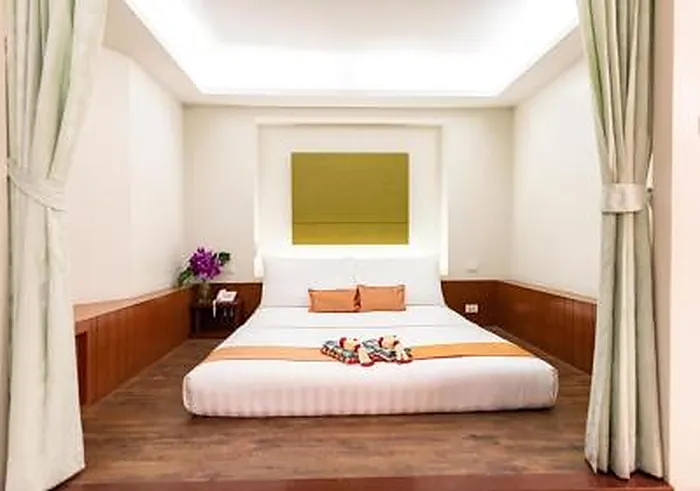 Superior room with modern Thai-inspired interior at Dang Derm Hotel